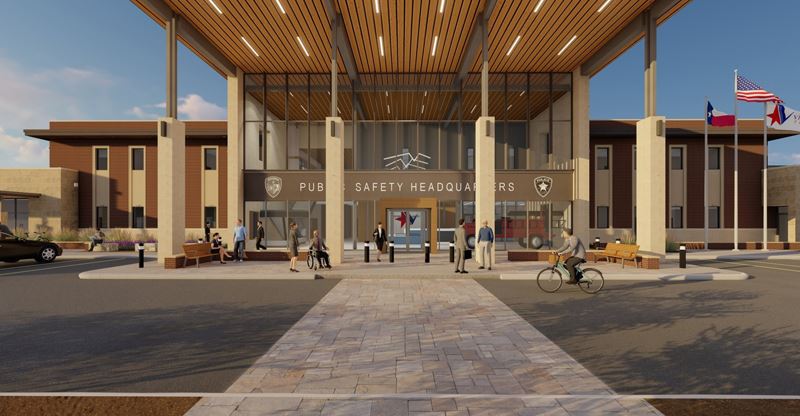 Exterior of the public safety headquarters. A large two-story building with public safety logos