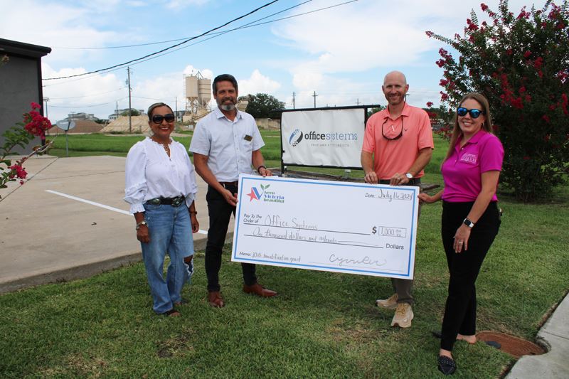 Group photo with a giant check at Office Systems