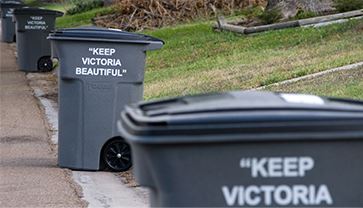 Trash hopper on curb