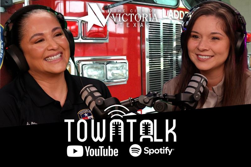 Annette Ponce and Ashley Strevel with a fire truck background