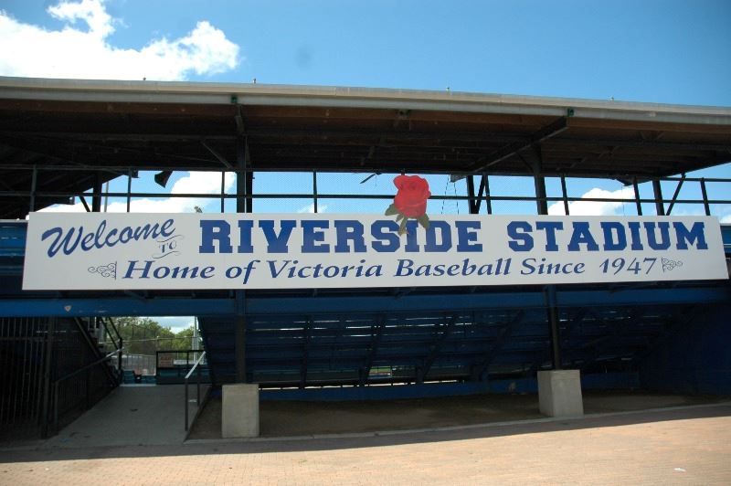 Sign on the baseball stands labeled riverside stadium
