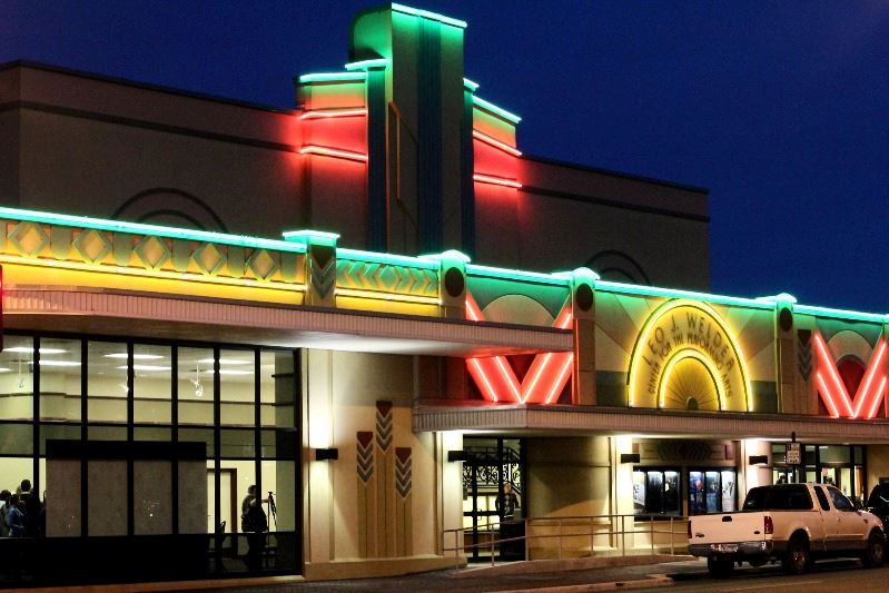 The Leo J. Welder Center for the Performing Arts at night with neon lighting