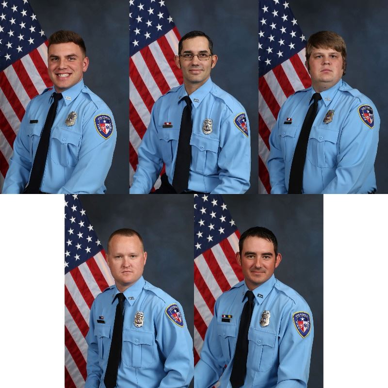 Portraits of five Victoria Fire Department employees in uniform with American flags