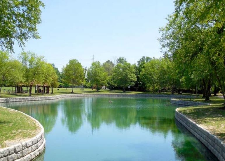 Pond with faux stone wall around the edges to prevent erosion