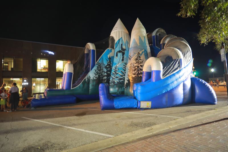 A giant inflatable slide that looks like a snow covered mountain