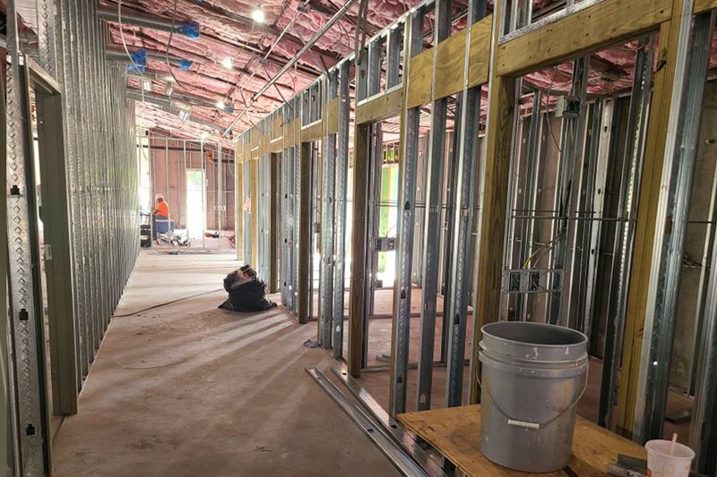 Building under construction with small separate rooms being built