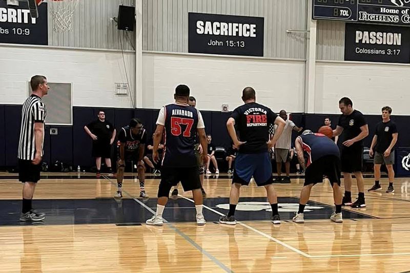 A basketball player prepares to make a shot