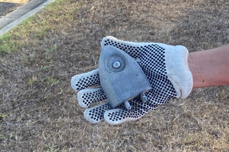 A metal object that is roughly shaped like a spaceship