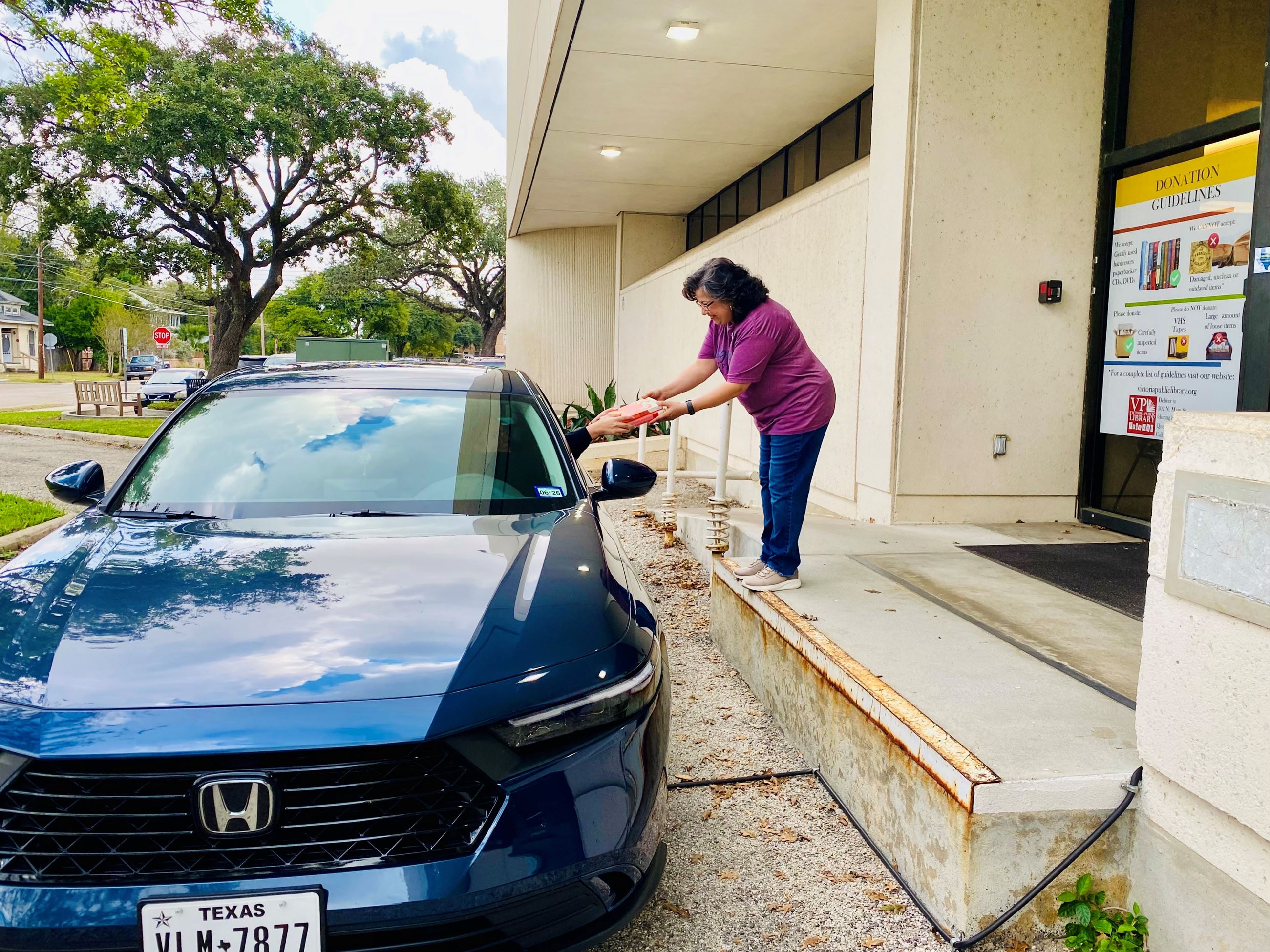 Picture of patron using the curbside service