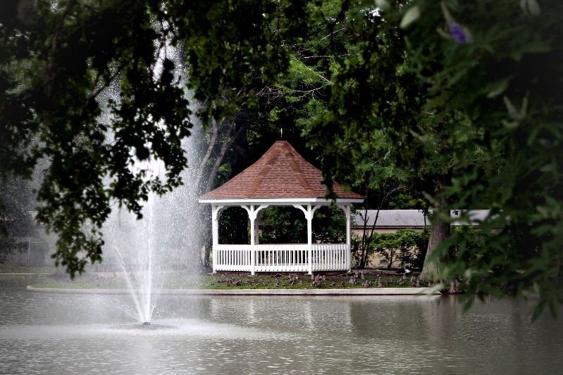 Riverside Park duck pond gazebo with water feature in foreground