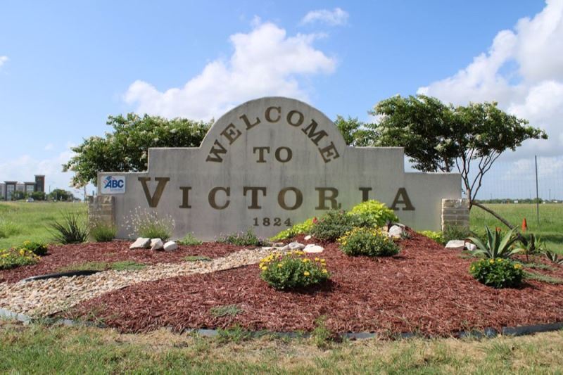 Welcome to Victoria sign with succulent plants and other landscaping