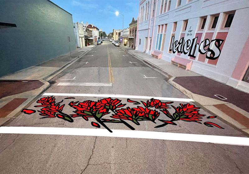 Crosswalk painted with red Indian Paintbrush flowers